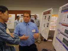 student presenting research poster