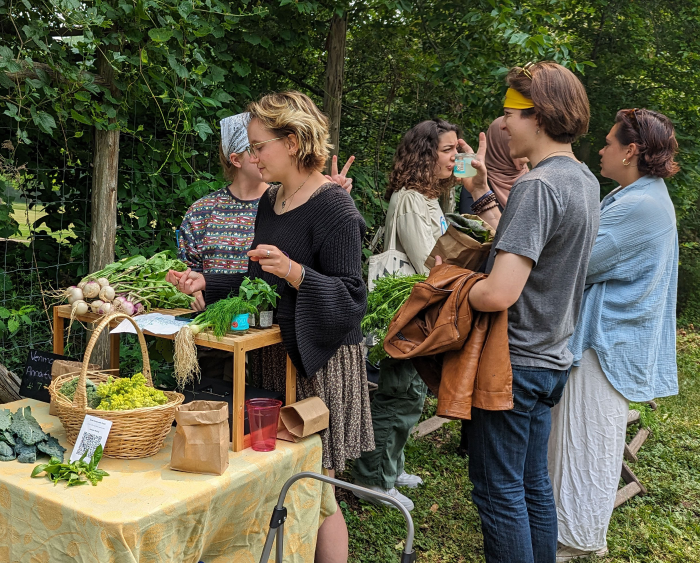 students selling produce at the garden sale