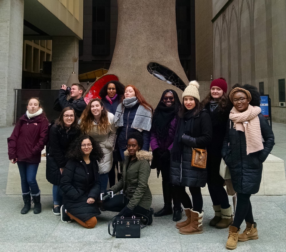 mll students in front of a sculpture