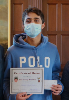 Aryan Kalluvila holding first-place certificate