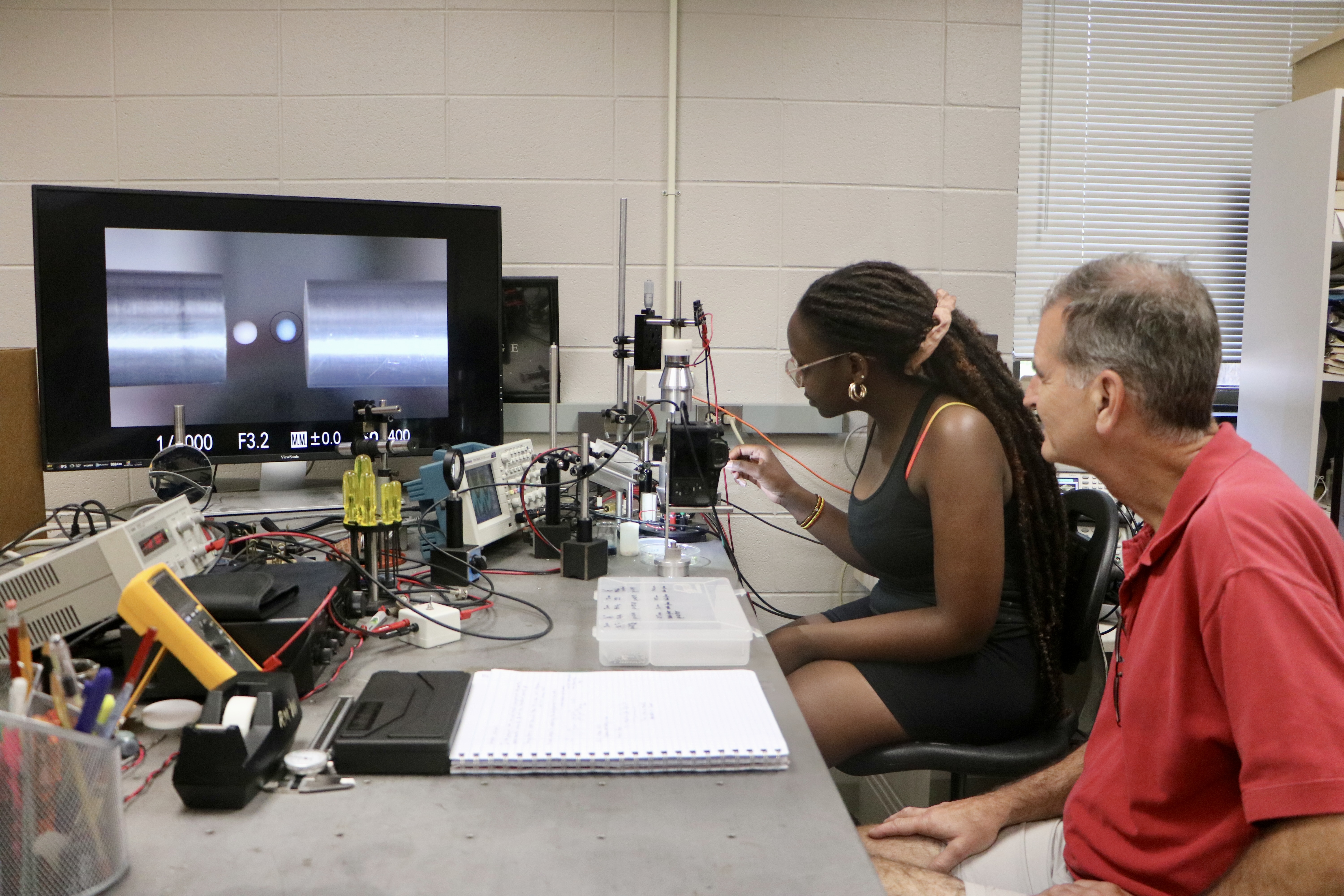 a student and professor run an experiment