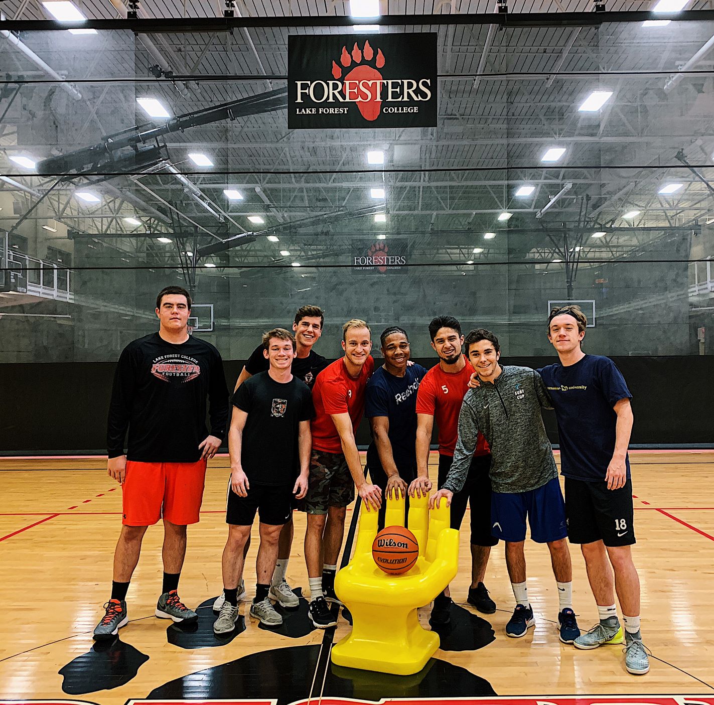 Athletes stand with Handshake chair