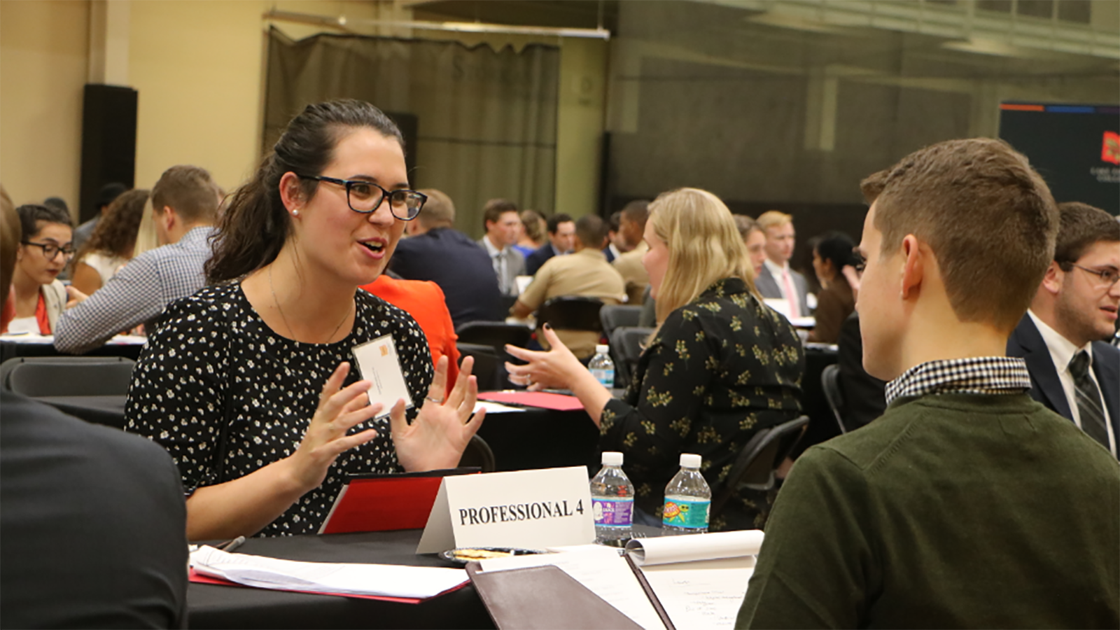 Student speaking with employer
