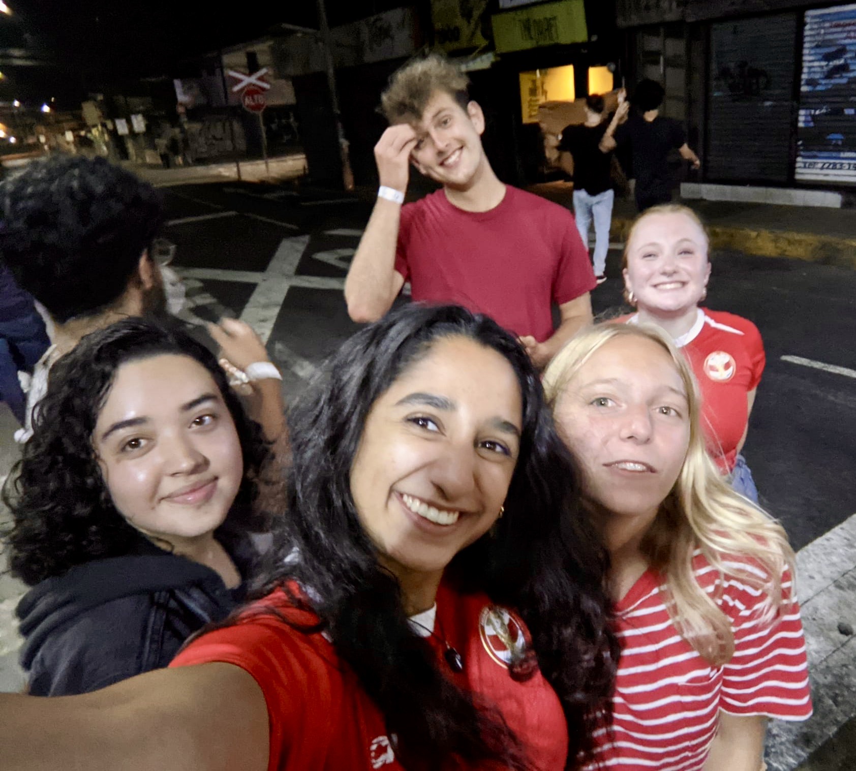 Students taking selfie outside soccer game in Costa Rica