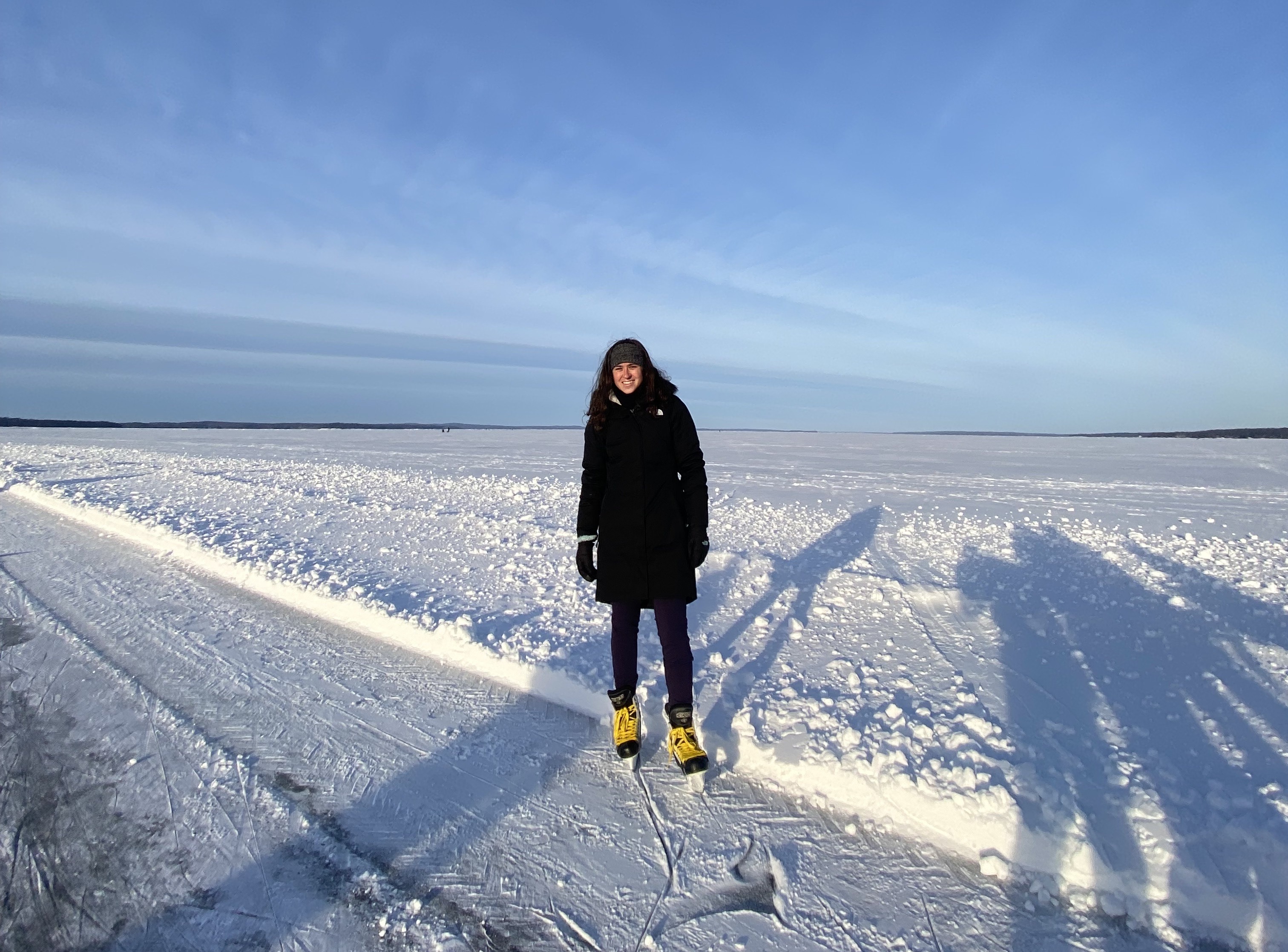 Hannah skating on a lake