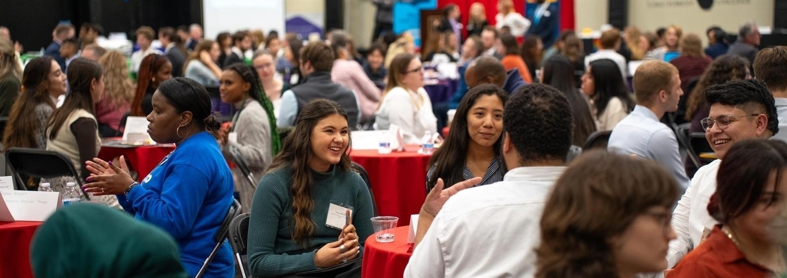 students and professionals at speed networking