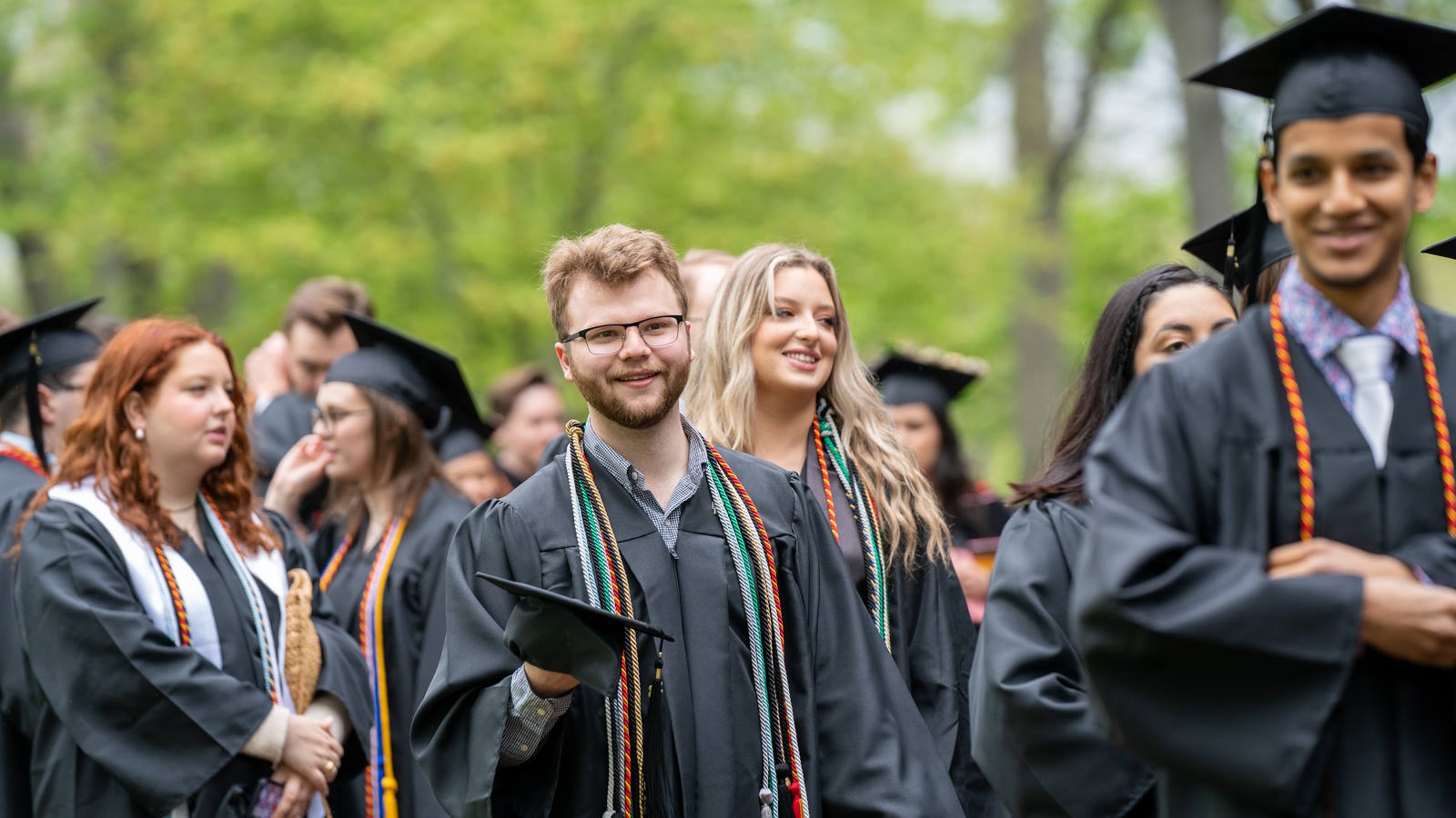 students walking at commencement