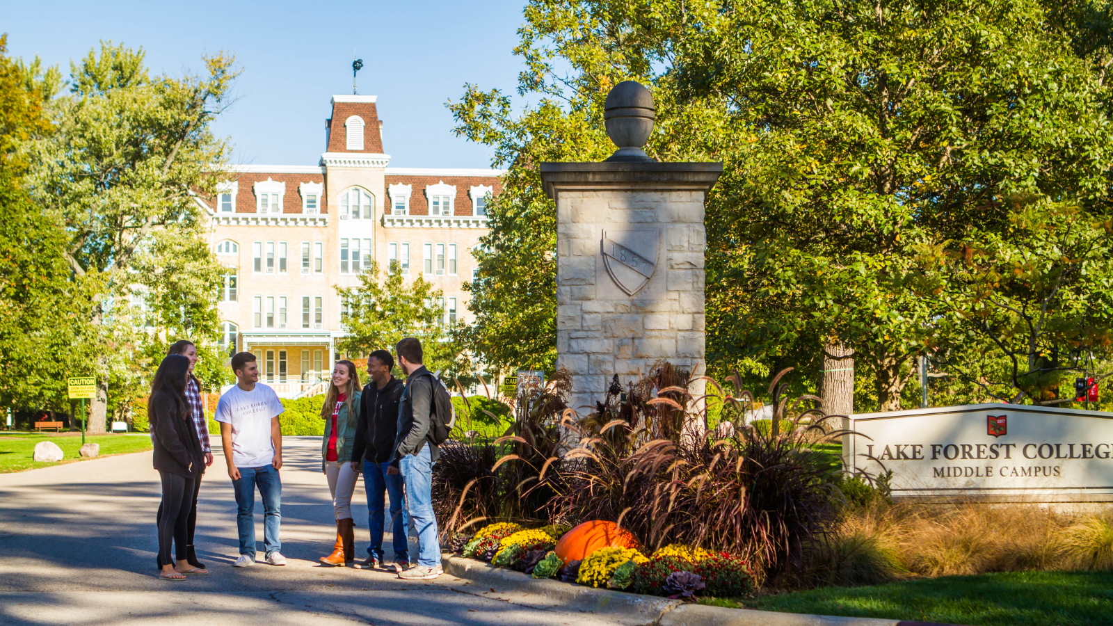 Students at front gates of college