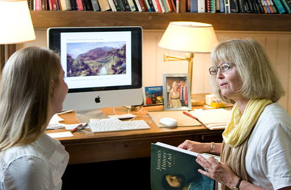 Teacher helping student