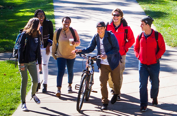 students walking down a path on campus