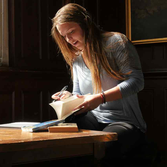Girl reading a book.