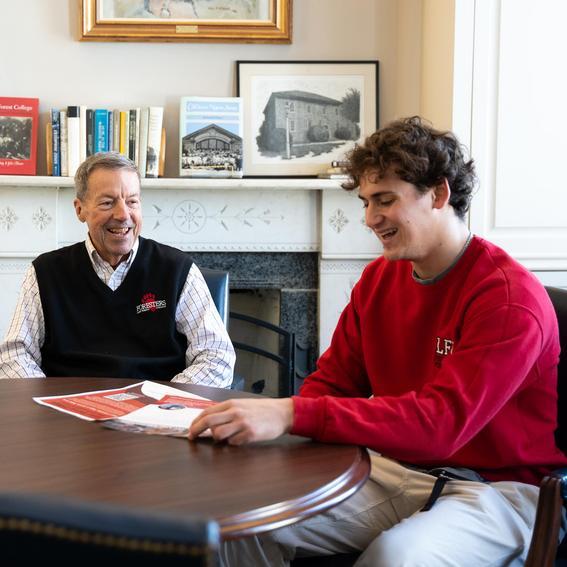 a student talking with a College employee