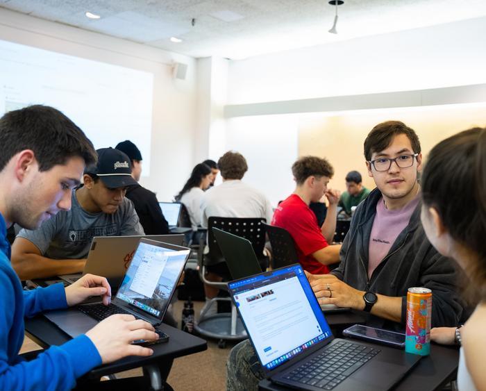 students discussing AI art in a classroom