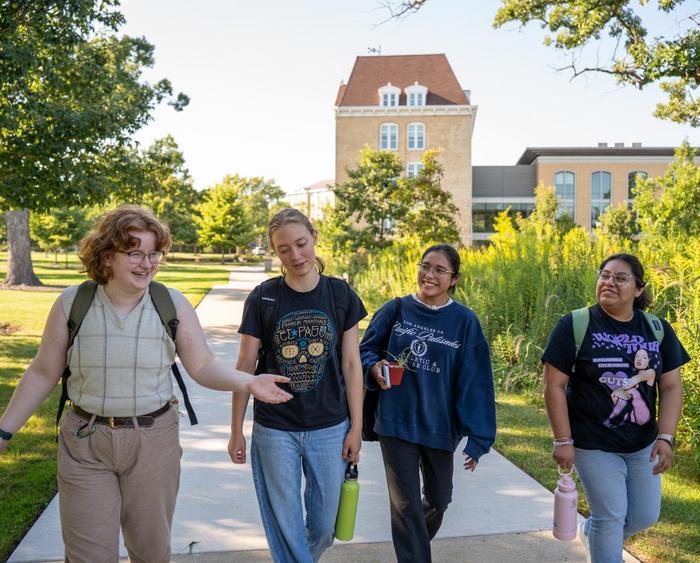 students walking through middle campus