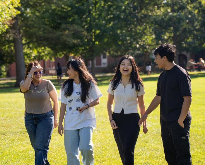 students walking and laughing on campus
