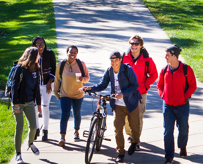 A group of students walking through campus. 