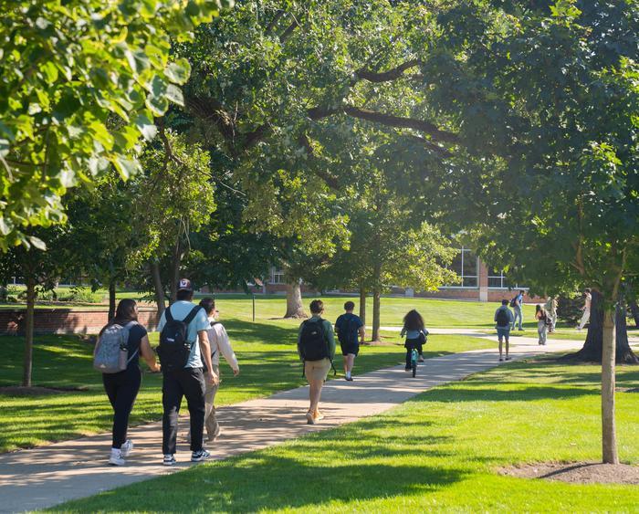 students walking across campus