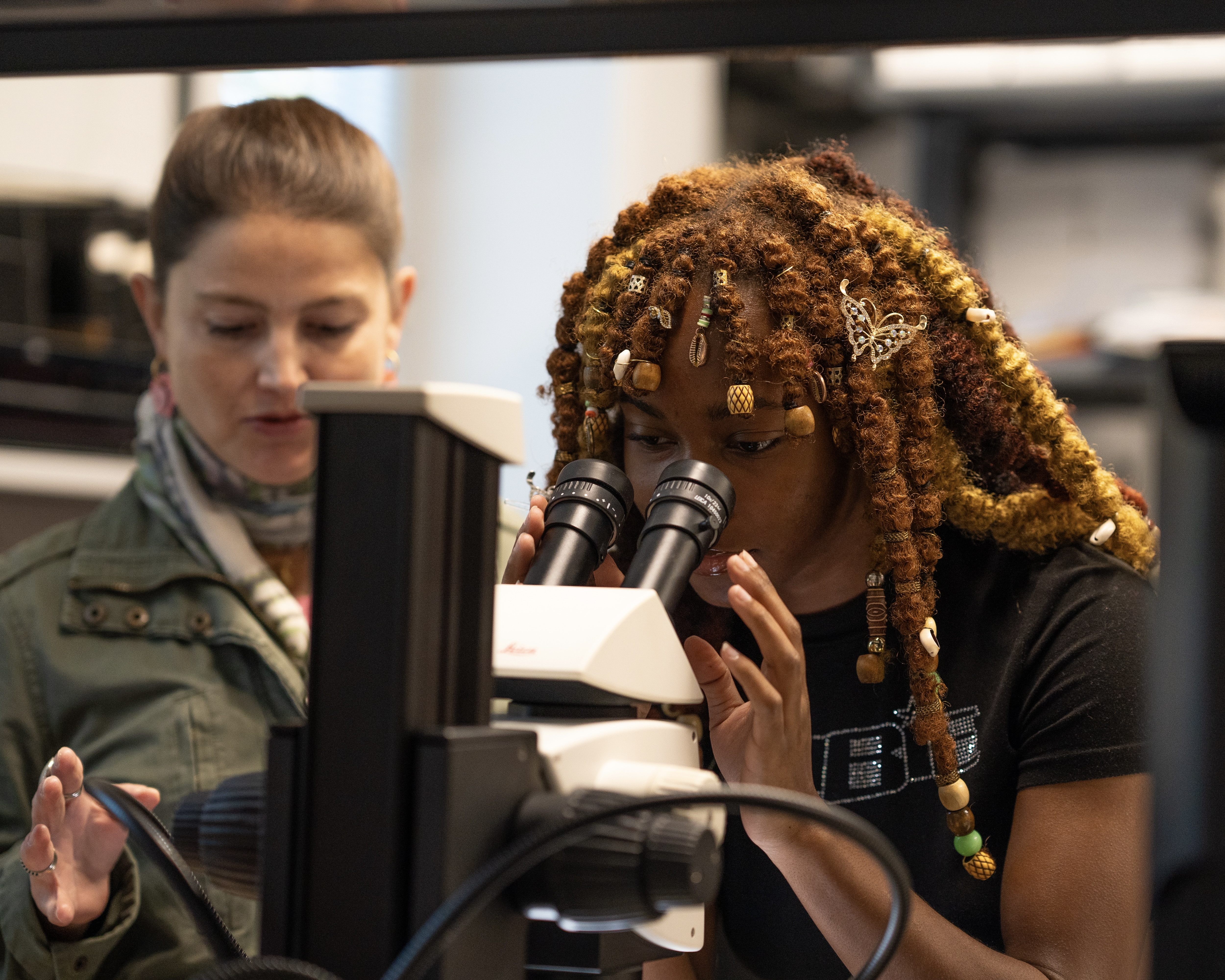 Student using microscope