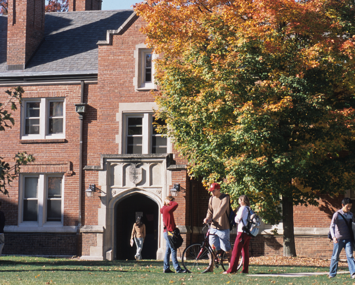 A group of students walking through campus. 