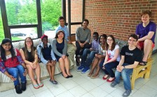 Professor and lab students seated in group