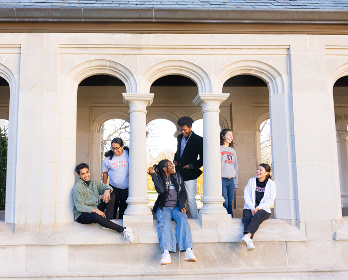 students sitting in breezeway window openings