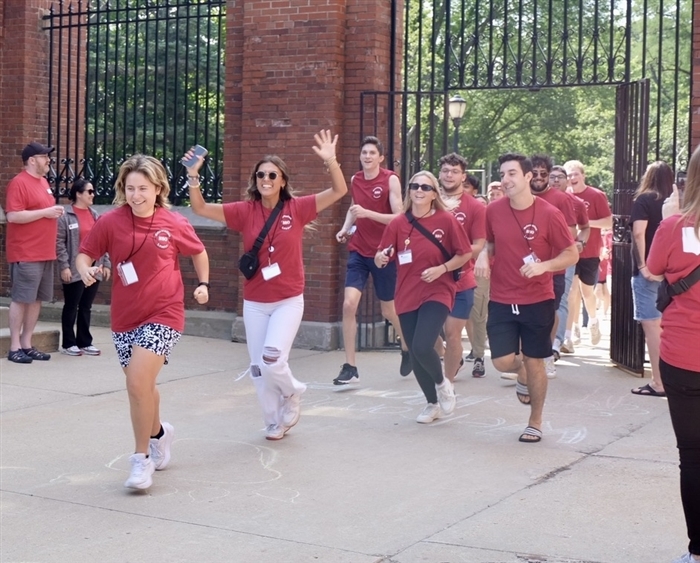 Student ambassadors running through Harlan Gates