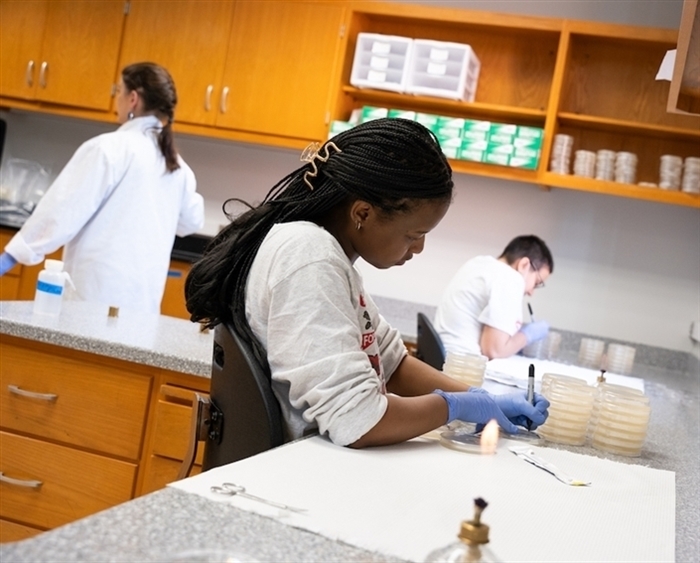 professor and students in lab