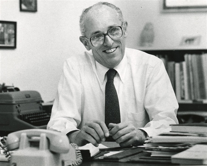 Gene Hotchkiss at desk in 1983