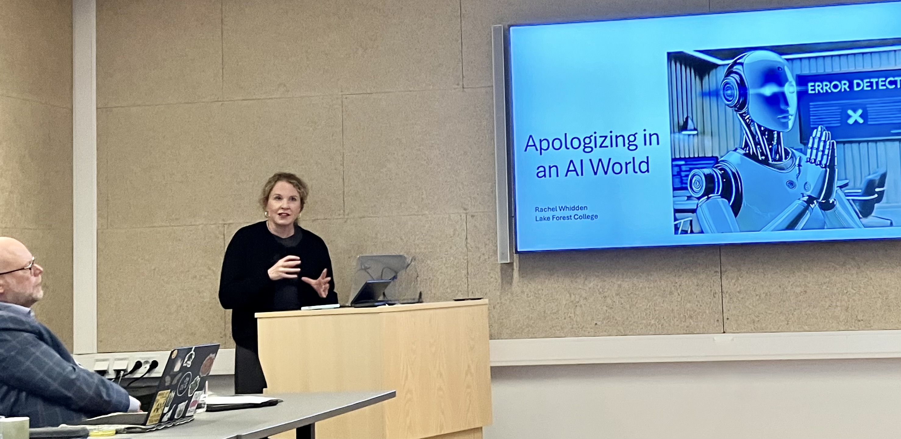 professor speaking at podium