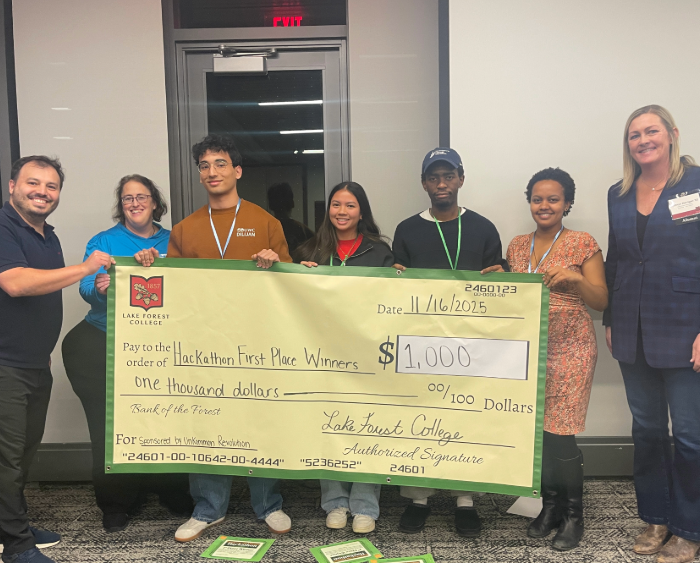 students with large check winning team
