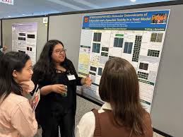 Student presenting research poster