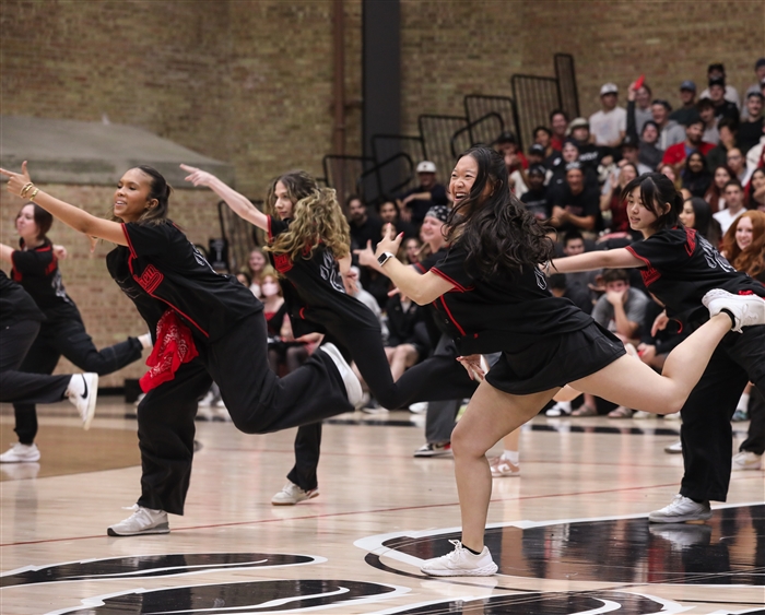 Dance team performing in gym