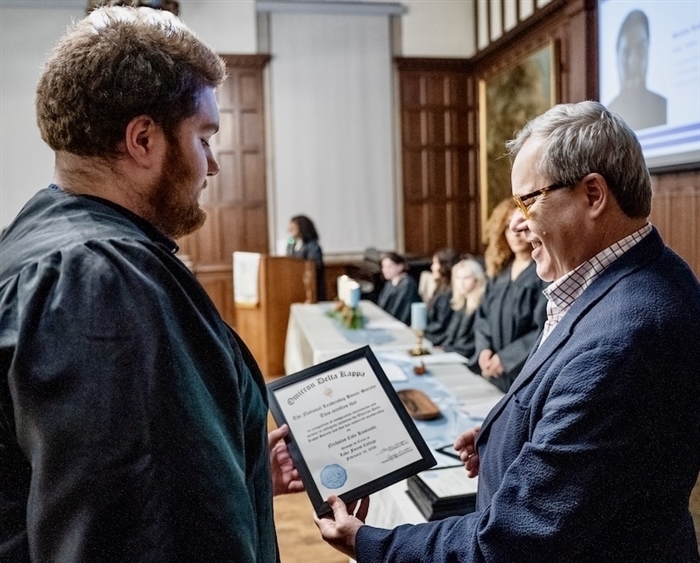 ODK inductee receiving certificate