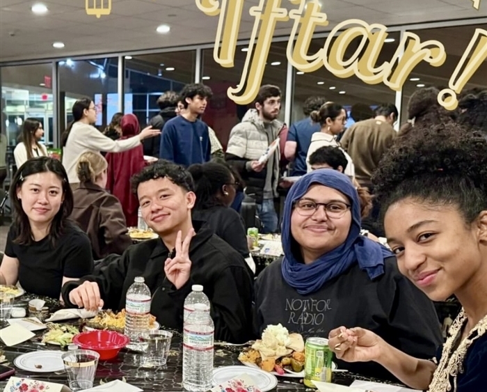 Students around dinner table