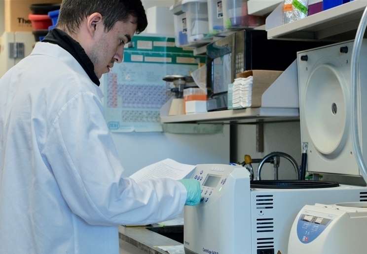 Demetri Maglares performing lab duties