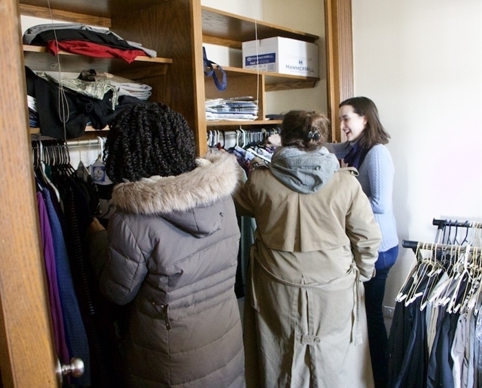 Three students selecting professional attire