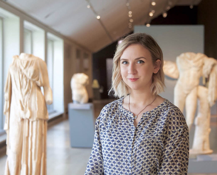 Student in front of sculptures at Art Institute