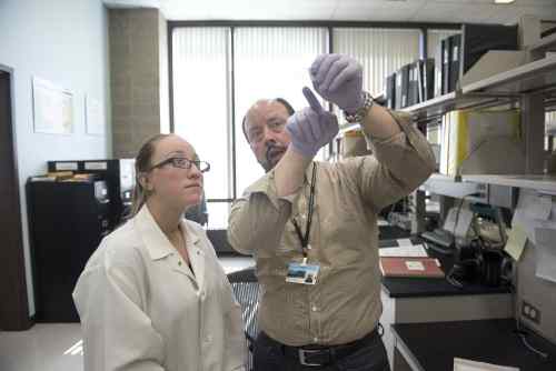 Student and professor working in lab