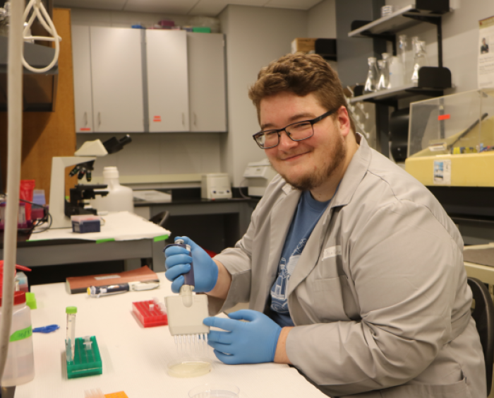 Ryan Osselborn working in a lab