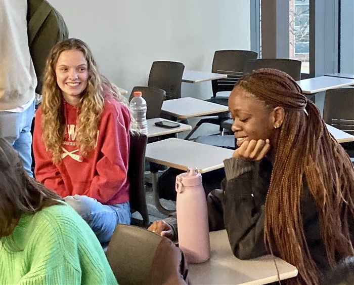 Two female students sharing a laugh