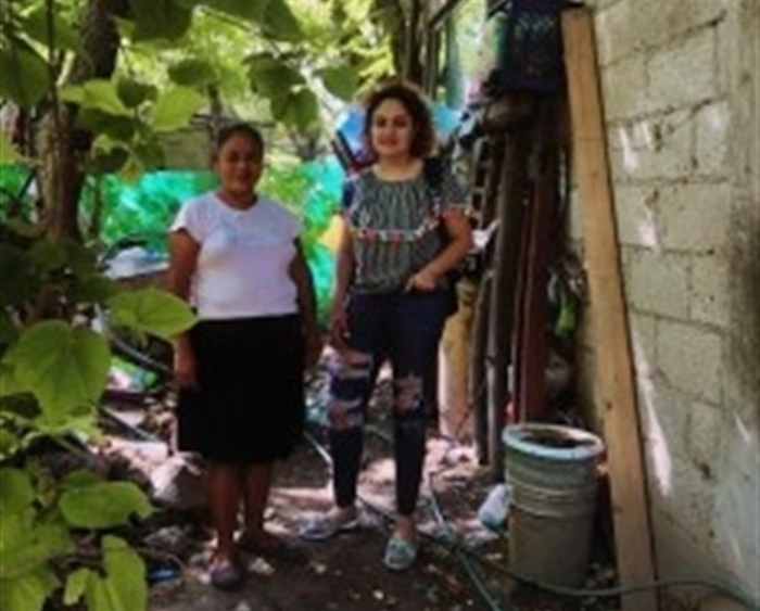 Carolina Guadarrama '19 and woman in Alpuyeca, Morelos, Mexico, in front of installed water filters