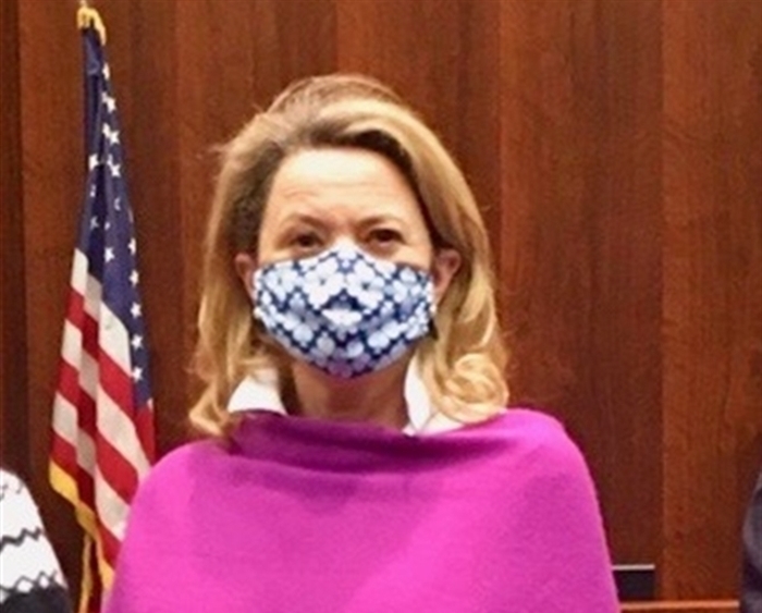 Masked Christine Walker in Illinois Capitol