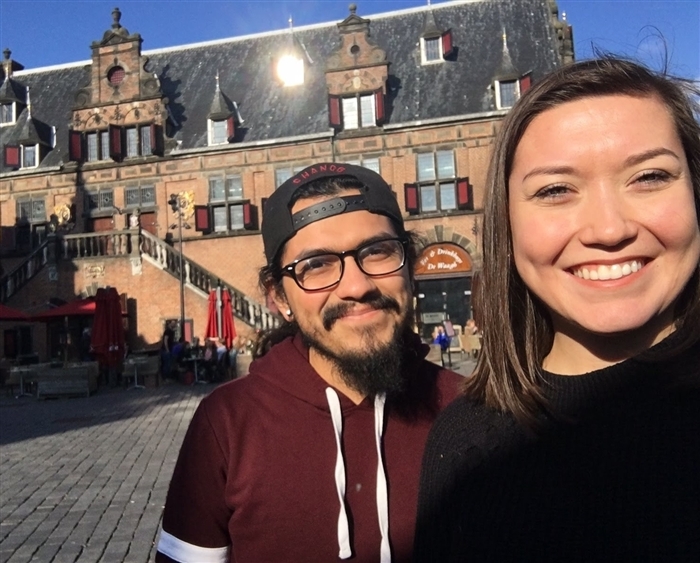 Two students in front of a building in Europe