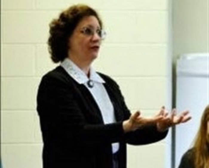 Professor teaching in front of classroom