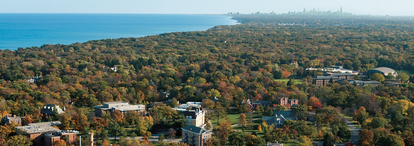 Aerial of campus with Lake Michigan and Chicago skyline on horizon