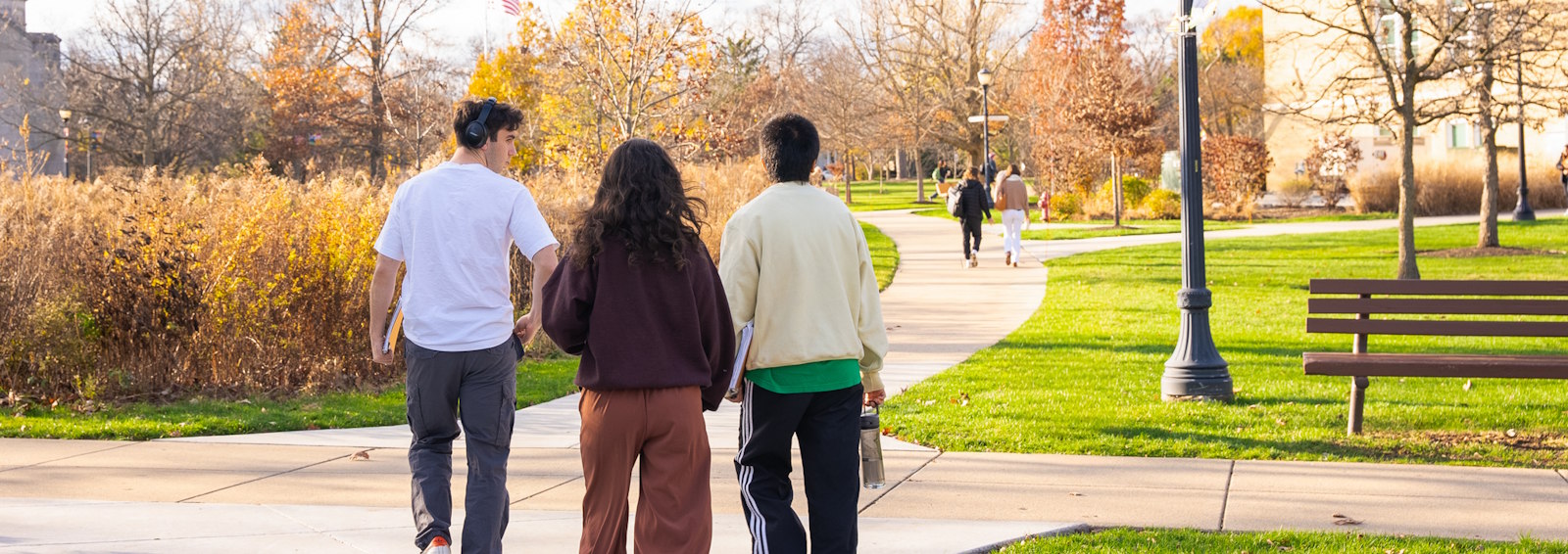 students walking on campus in fall