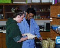 student and professor in lab