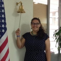 alumna ringing school bell