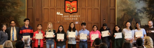 The Top 11 Finalists hold their diplomas.