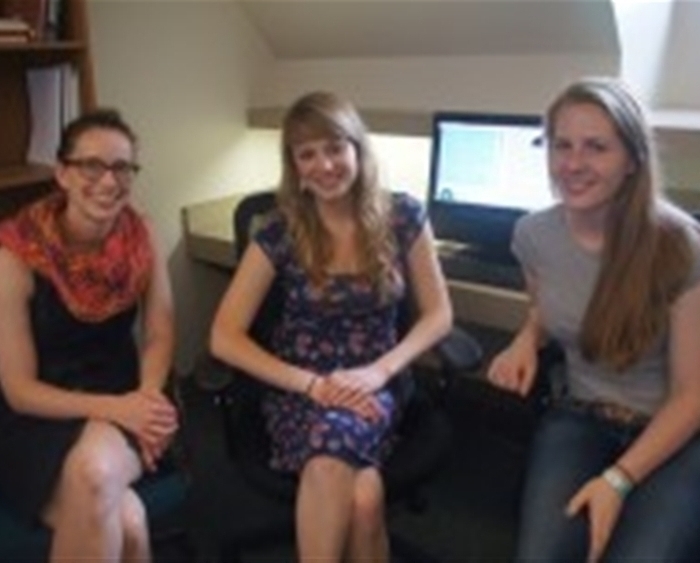 psychology professor and two students in research lab